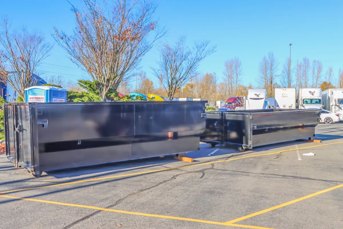 Professional dumpster rental service with roll-off container on residential driveway in Shoreview